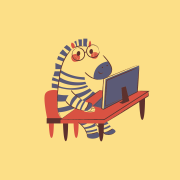 Ein Zebra mit Brille an einem Schreibtisch mit einem Computer
