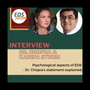 A photo of Dr. Chopra, a man with short brown hair and glasses. Next to him is an image of Karina, a woman with short brown hair and leaf-shaped dangling earrings. Next to her is the EDS Awareness Logo with text: Interview, Dr. Chopra & Karina Sturm, Psychological aspects of EDS - Dr. Chopra’s Statement explained.
